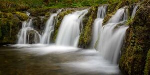 A waterfall photographed on a Peak District landscape photography course in Lathkill Dale. Photo © Chris James